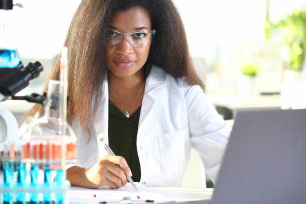 istock Black female chemist student conducting research 1056467774