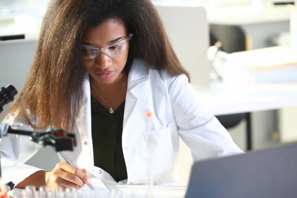 istock Black female chemist student conducting research 1056468006