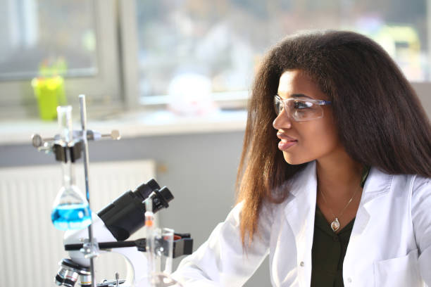 istock Black female chemist student conducting research 1056468044