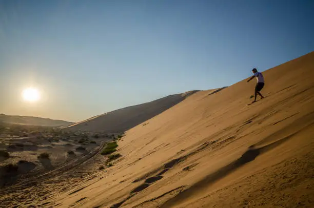 Sandboarding in the desert of Liwa
