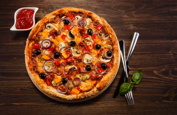 istock Pizza pepperoni with black olives 1056469028