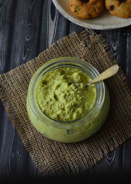 Rajkot Chutney, Peanut and Green chili chutney A very popular and delicious chutney made with peanuts and green chili, it is a specialty from Rajkot city. It can be served with any snack or as a spread for sandwiches. rajkot india stock pictures, royalty-free photos & images