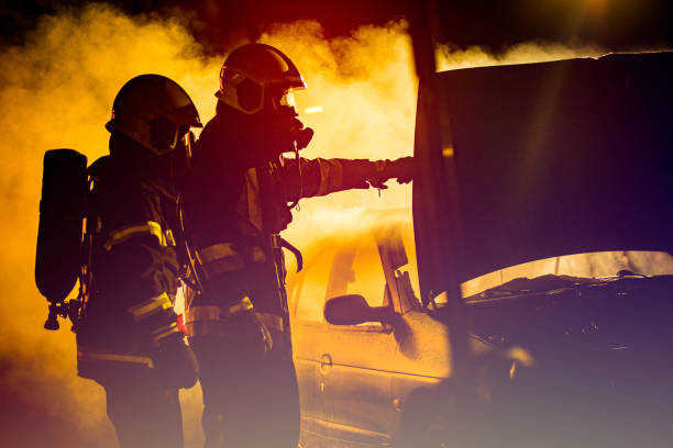 istock Two firefighters at a traffic accident scene full of smoke 1056471478