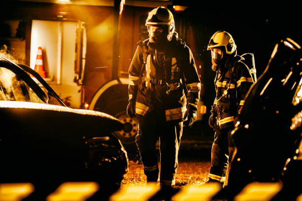 istock Two firefigters walking around the scene after successfully extinguishing a fire 1056471582