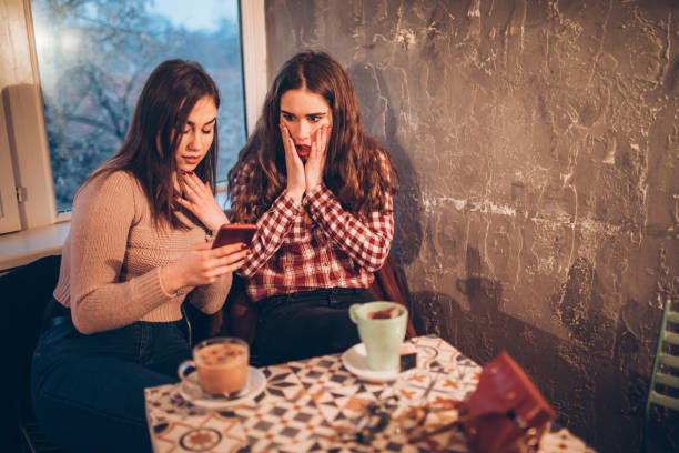 istock Two female friends on a coffee break downtown 1056473478