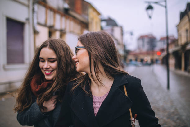 istock Two female friends going for a walk downtown 1056475420