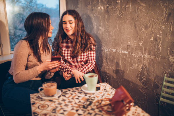 istock Two female friends on a coffee break downtown 1056477016