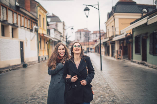 istock Two female friends going for a walk downtown 1056477144