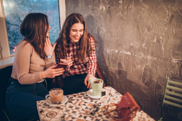 istock Two female friends on a coffee break downtown 1056479732