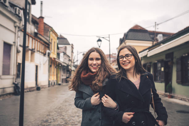 istock Two female friends going for a walk downtown 1056483716