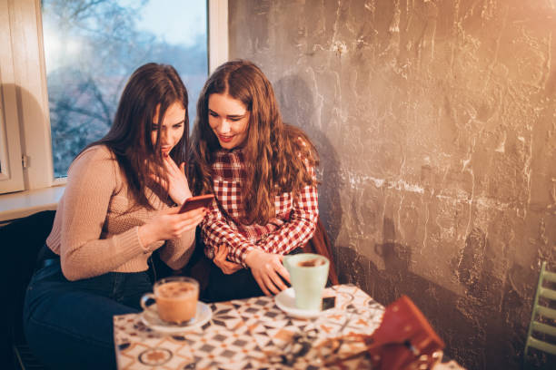 istock Two female friends on a coffee break downtown 1056485444
