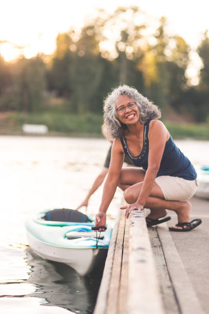 istock A beautiful older woman prepares to go kayaking 1056486174