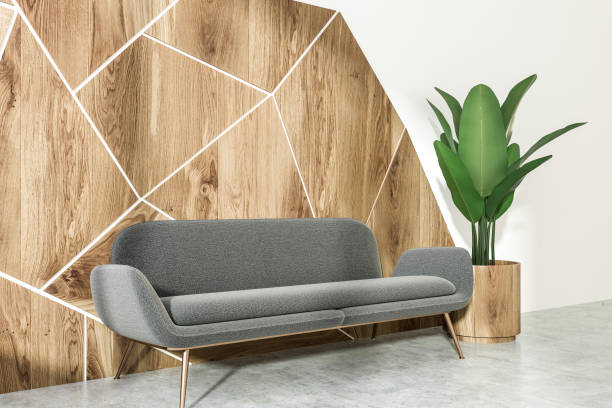 istock Gray sofa white and wooden living room, side view 1056488850