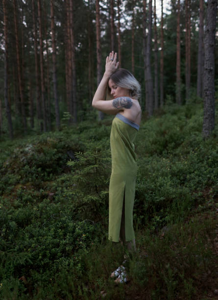 istock young girl stands in a pine forest 1056520102