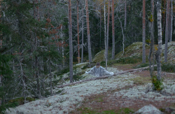 istock girl with white wings in the forest 1056520182