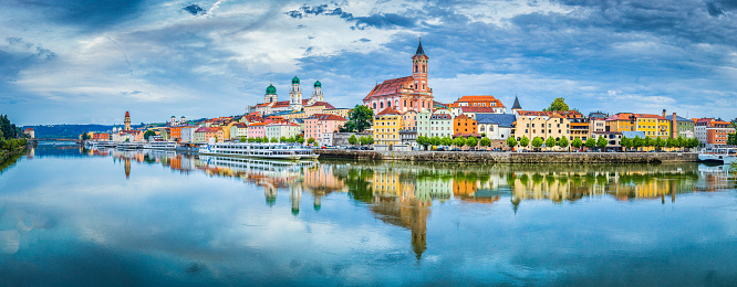 Panoramic view of the historic city of Passau reflecting in famous Danube river in beautiful evening light at sunset, Bavaria, Germany