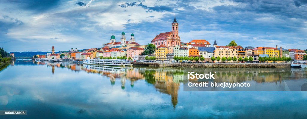 Passau city panorama with Danube river at sunset, Bavaria, Germany Panoramic view of the historic city of Passau reflecting in famous Danube river in beautiful evening light at sunset, Bavaria, Germany Cruise - Vacation Stock Photo