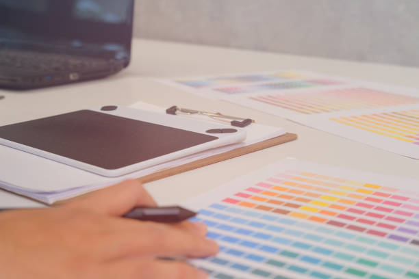 istock graphic interior designer choosing color from swatch sample catalogue palette guide. artist design & idea for creativity project. 1056532230