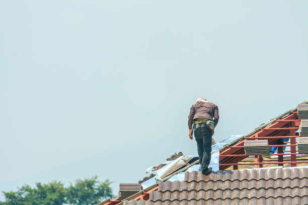 istock Construction roofer installing roof tiles at house building site 1056532394