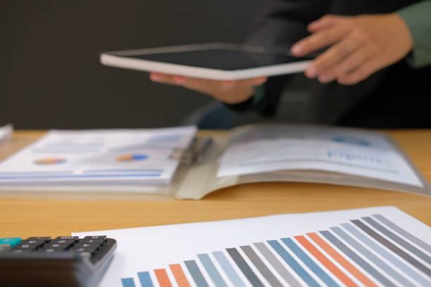 istock man organizing plan with tablet. businessman working at workplace 1056532558