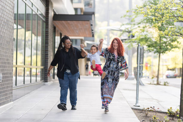 istock Female couple walking with their son 1056539418