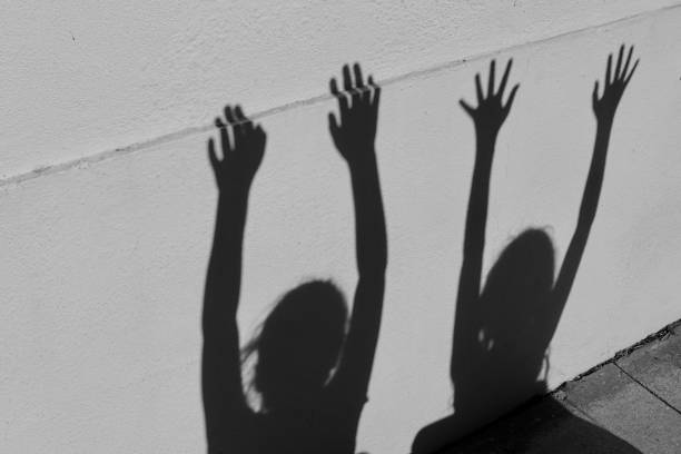 istock Expressive Shadows of girl on wall 1056553970