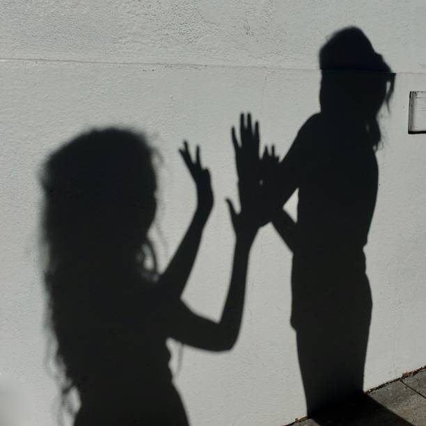 istock Expressive Shadows of girl on wall 1056553978