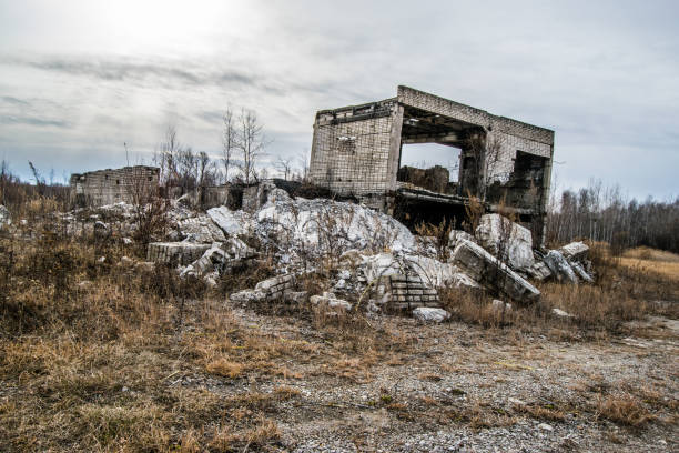 istock Old destroyed an abandoned multi-storey building in a military t 1056562498