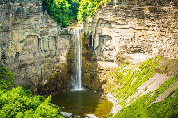 istock Scenic high mountain waterfall at sunny day 1056563756