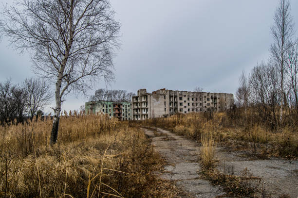istock Old destroyed an abandoned multi-storey building in a military t 1056564020