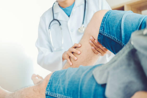istock Doctor consulting with patient Knee problems Physical therapy concept 1056564354