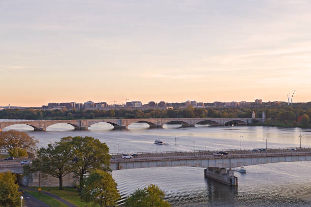 Washington DC panorama with bridges across Potomac River at sunset. Scenic view on US capital landscape in early fall. arlington memorial bridge photos stock pictures, royalty-free photos & images