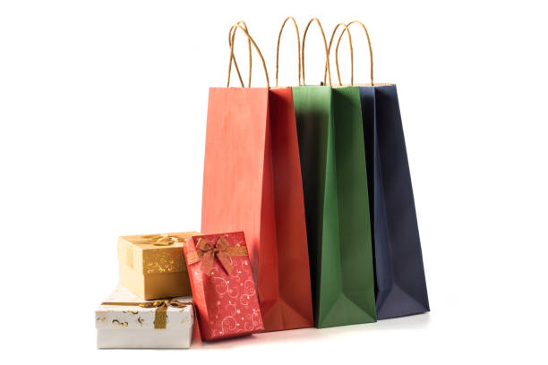 istock Colourful paper shopping bags with gift boxes on white background 1056579136