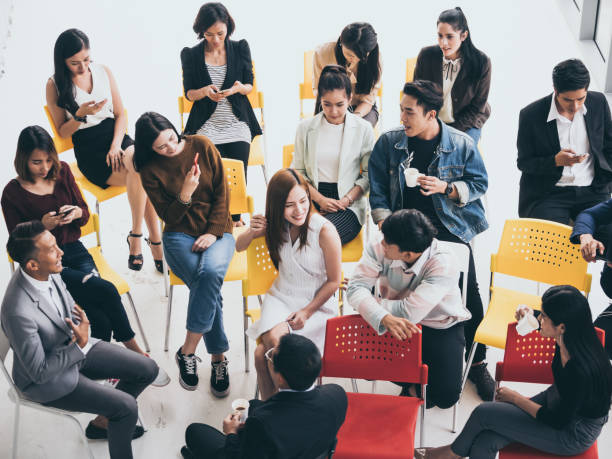 istock Group of people are talking together while taking a coffee break from seminar 1056579188