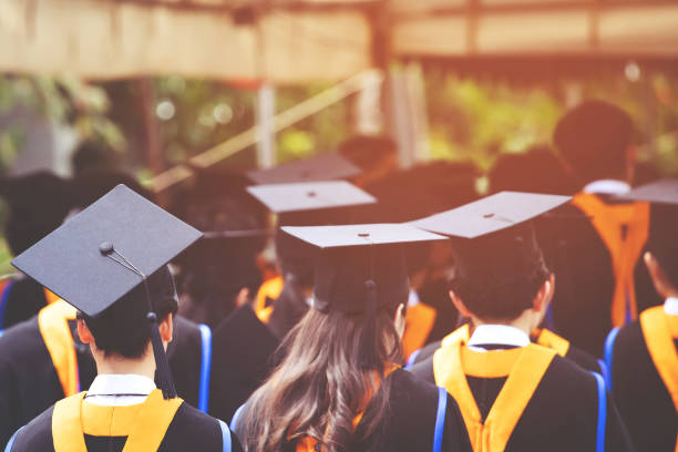 istock backside graduation hats during commencement success graduates of the university, Concept education congratulation. Graduation Ceremony ,Congratulated the graduates in University during commencement. 1056585120