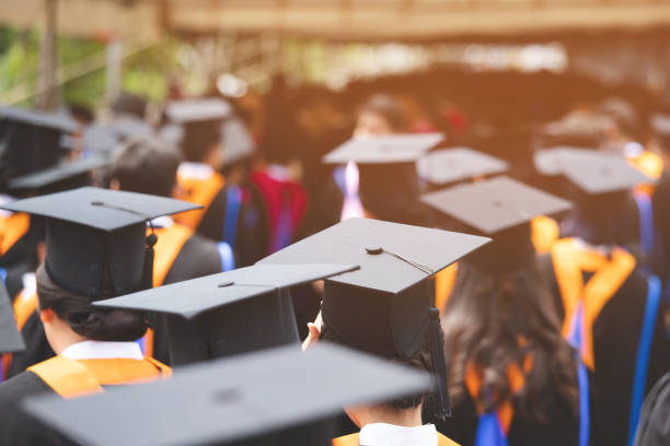 istock backside graduation hats during commencement success graduates of the university, Concept education congratulation. Graduation Ceremony ,Congratulated the graduates in University during commencement. 1056585148