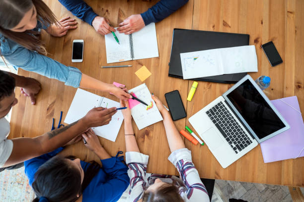 istock Young business team working together at office 1056591066