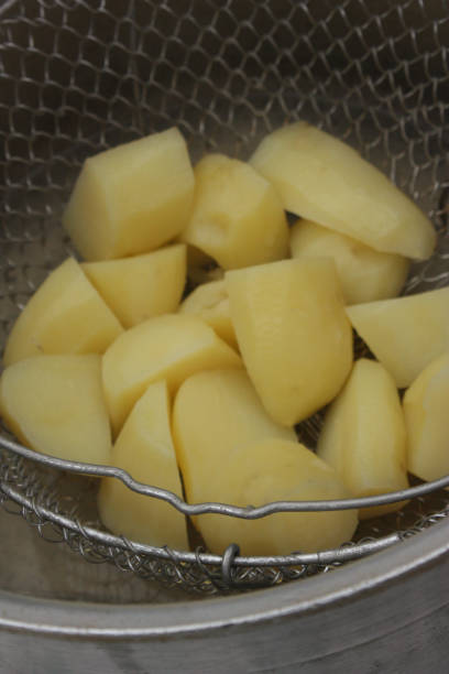 istock Potatoes steamed in a pressure cooker 1056591130