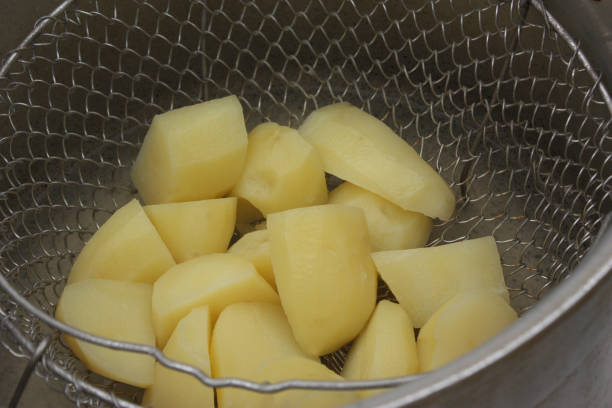 istock Potatoes steamed in a pressure cooker 1056591142