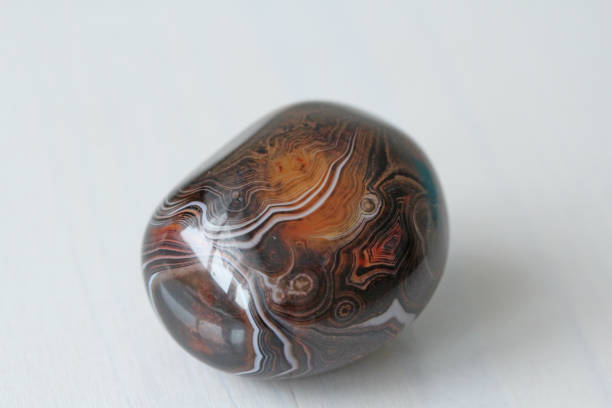 istock Agate. Natural round or oval stone agate with striped texture or pattern. A beautiful stone is agate 1056591570