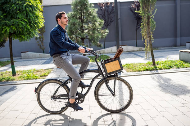 istock Handsome man moving around the city on bicycle 1056591934