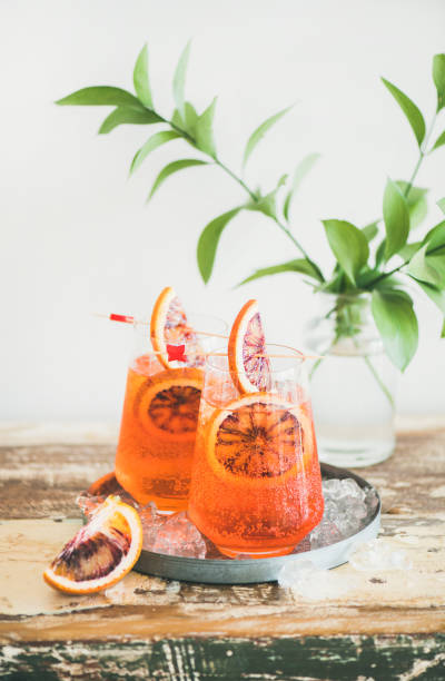 istock Spritz cocktail drink with orange and ice on table 1056594850
