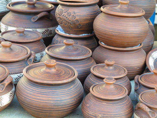 istock Handmade ceramic clay brown pottery, souvenirs at handicraft market 1056604788