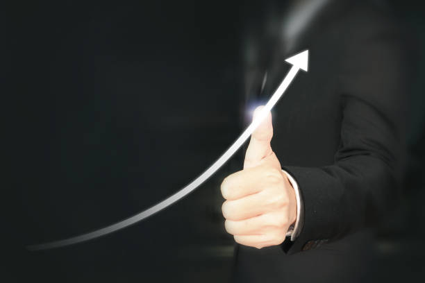 istock Businessman plan graph growth and increase of chart positive indicators 1056607920