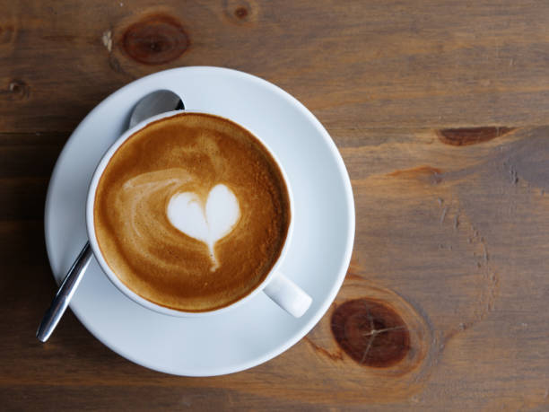 istock hot lattee art top view , heart and copyspace, beverage concept. 1056608504