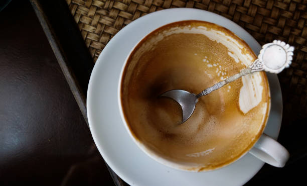 istock Coffee stains out on wooden background and copyspace, drink and beverage concept. 1056608536