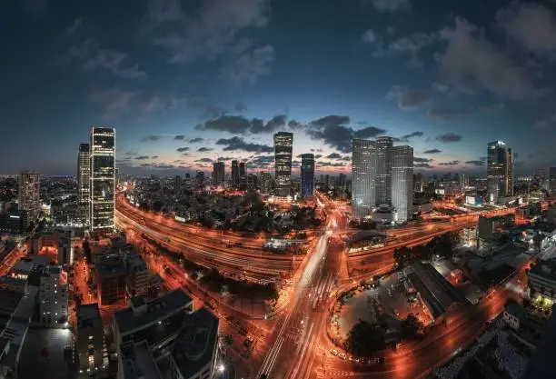 Photo of the city Tel Aviv from a high vantage point at sunset. Highway Ayalon. Station train hashalom. Asrieli Center. Electra Tower