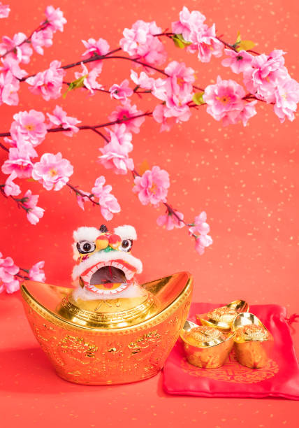 istock chinese traditional dancing lion with ingot 1056613278