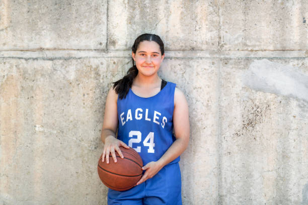 istock Confident female basketball player against wall 1056617270