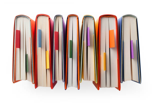 istock Colored books seen from above with bookmark on white background 1056618466